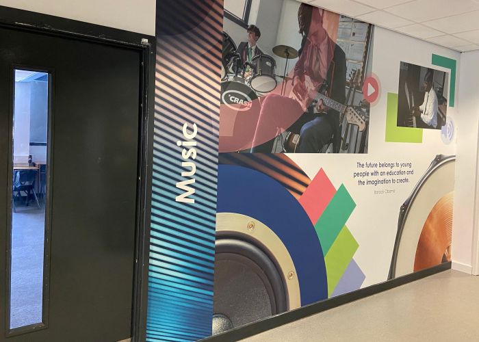School corridor wallpaper signage at Bradford Forster Academy